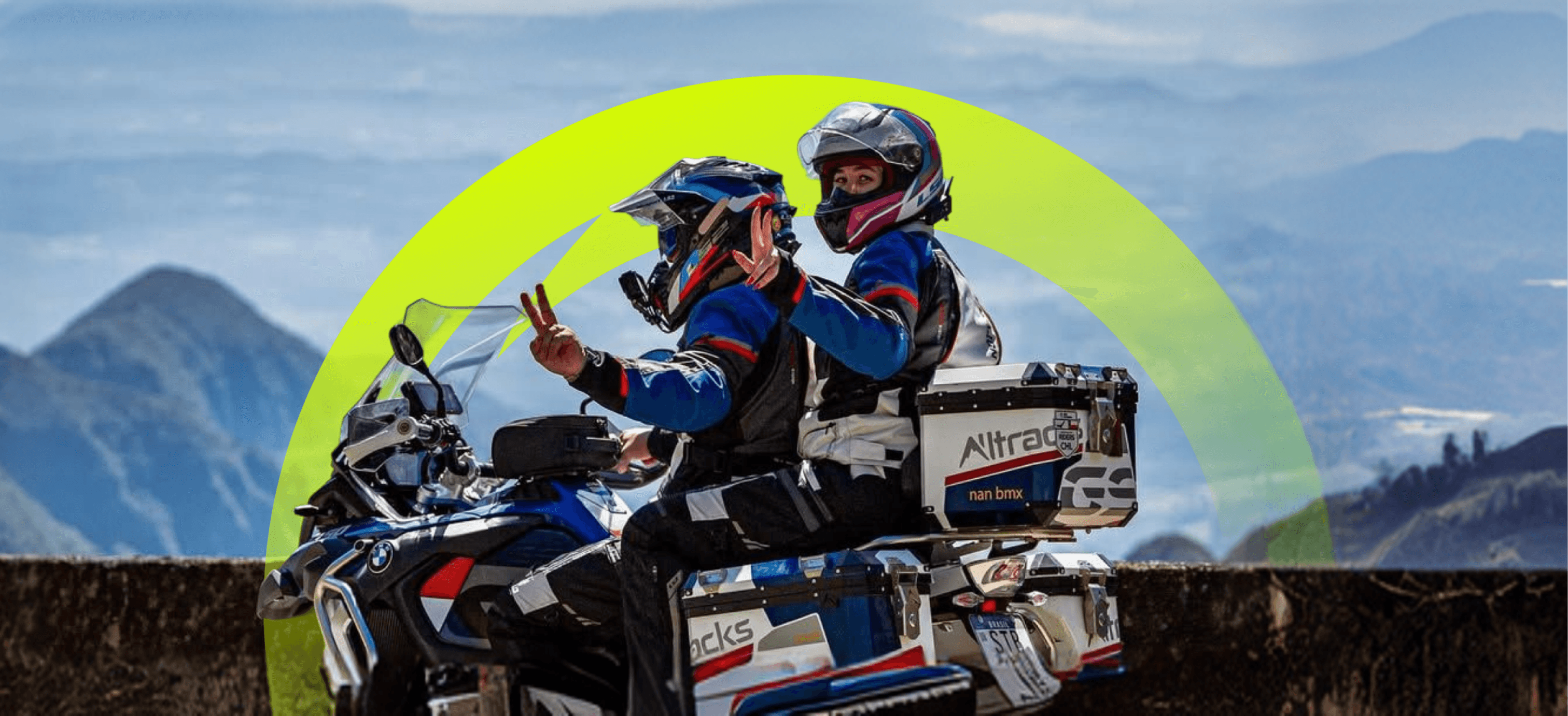 Two motorcyclists riding through open terrain